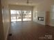Spacious living room featuring a fireplace and a sliding door to the deck with a lake view at 1120 Cedar St, Mount Holly, NC 28120