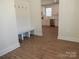 Mudroom with convenient hooks and bench seating, adjacent to the kitchen, perfect for organizing outerwear at 1120 Cedar St, Mount Holly, NC 28120