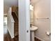 Stylish half bathroom with pedestal sink and modern fixtures at 1128 Tangle Ridge Se Dr, Concord, NC 28025