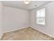 Empty bedroom with carpet floor and a window at 1128 Tangle Ridge Se Dr, Concord, NC 28025