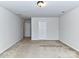 Spacious bedroom featuring neutral carpet, a ceiling light, and a closet at 1128 Tangle Ridge Se Dr, Concord, NC 28025