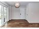 Bright dining area with sliding glass doors and modern light fixture at 1128 Tangle Ridge Se Dr, Concord, NC 28025