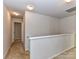 Hallway view features neutral walls, carpet floors, and recessed lighting at 1128 Tangle Ridge Se Dr, Concord, NC 28025
