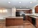 Kitchen with stainless steel appliances, a central island, and abundant counter space at 1128 Tangle Ridge Se Dr, Concord, NC 28025
