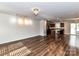 Spacious living room showcasing wood floors and an open layout to the kitchen at 1128 Tangle Ridge Se Dr, Concord, NC 28025