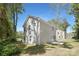 The rear exterior of this two-story home has light gray vinyl siding and a concrete patio at 114 I K Beatty St, Charlotte, NC 28214