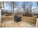 Back deck with wood railing and grill covered up in the middle of the deck at 1140 Roberts St, China Grove, NC 28023