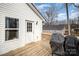 Back deck with grill, door into the house, and a view of the backyard at 1140 Roberts St, China Grove, NC 28023