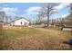 Backyard with a view of the house and the shed at 1140 Roberts St, China Grove, NC 28023