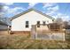 Backyard with deck, white lattice, storage shed and fire pit at 1140 Roberts St, China Grove, NC 28023