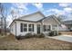 Charming single-story home with vinyl siding, dark shutters, and a welcoming front porch at 1140 Roberts St, China Grove, NC 28023