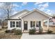 Charming single-story home featuring a welcoming front porch and manicured landscaping at 1140 Roberts St, China Grove, NC 28023