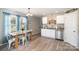 Eat-in kitchen featuring white cabinets, stainless steel appliances, and ample natural light at 1140 Roberts St, China Grove, NC 28023