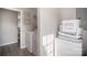 Laundry room with washer, dryer, and storage, as well as decorative 'Wash Dry Fold' signs at 1140 Roberts St, China Grove, NC 28023