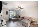 Bright living room with a large sectional couch, ceiling fan, and modern decor at 1140 Roberts St, China Grove, NC 28023