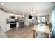 Modern interior view of the kitchen and living room featuring an open floor plan concept at 1140 Roberts St, China Grove, NC 28023