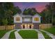 Charming exterior view of a modern two-story home featuring a well-manicured lawn and a two-car garage at 118 I K Beatty St, Charlotte, NC 28214