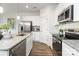 Contemporary kitchen features stainless steel appliances, granite countertops and ample cabinet space at 118 I K Beatty St, Charlotte, NC 28214