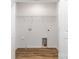 Clean and modern laundry room with new flooring and utility connections at 118 I K Beatty St, Charlotte, NC 28214