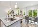 Bright, open living space with a modern kitchen island overlooking the dining and living areas at 118 I K Beatty St, Charlotte, NC 28214