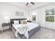 Bright and airy bedroom with large windows, tray ceiling, and coordinated furnishings at 118 I K Beatty St, Charlotte, NC 28214