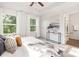 Serene bedroom featuring ample natural light, a decorative tray ceiling, and a stylish ensuite at 118 I K Beatty St, Charlotte, NC 28214