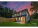 Beautiful two-story home featuring a fenced yard and patio, perfect for outdoor gatherings at 122 I K Beatty St, Charlotte, NC 28214