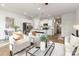 Open-concept living room flows into a modern kitchen with stainless steel appliances and sleek countertops at 122 I K Beatty St, Charlotte, NC 28214