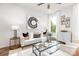 Cozy living room bathed in natural light features stylish furnishings and a modern decorative art piece at 122 I K Beatty St, Charlotte, NC 28214