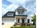 Charming two-story home featuring a 2-car garage and landscaped yard at 13708 Tranquil Day Dr, Matthews, NC 28105