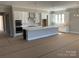 Modern kitchen with stainless steel appliances, island, and pendant lighting at 13708 Tranquil Day Dr, Matthews, NC 28105