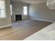 Bright living room with fireplace and large windows at 13708 Tranquil Day Dr, Matthews, NC 28105