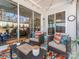 Relaxing covered patio with seating area, and view of backyard at 14543 Crosswater Ln, Charlotte, NC 28278