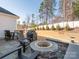 Private backyard with fire pit, patio, and grill at 14543 Crosswater Ln, Charlotte, NC 28278