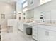 Elegant bathroom with double vanity, large mirror, and walk-in shower at 14543 Crosswater Ln, Charlotte, NC 28278