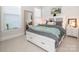 Well-lit bedroom with white bed frame and storage drawers at 14543 Crosswater Ln, Charlotte, NC 28278
