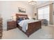 Charming bedroom with rustic bed frame and built-in desk area at 14543 Crosswater Ln, Charlotte, NC 28278