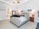 Spacious bedroom with plush bed and en-suite bathroom access at 14543 Crosswater Ln, Charlotte, NC 28278