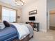 Bright bedroom with a comfy bed and media center at 14543 Crosswater Ln, Charlotte, NC 28278