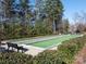 Community bocce ball court with benches at 14543 Crosswater Ln, Charlotte, NC 28278