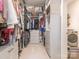 Large walk-in closet with ample shelving and drawers at 14543 Crosswater Ln, Charlotte, NC 28278