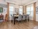 Bright dining room with hardwood floors and seating for six at 14543 Crosswater Ln, Charlotte, NC 28278