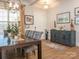 Elegant dining room with hardwood floors, large table, and chandelier at 14543 Crosswater Ln, Charlotte, NC 28278