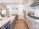Kitchen features white cabinets, quartz countertops, and a farmhouse sink at 14543 Crosswater Ln, Charlotte, NC 28278