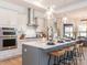 Modern kitchen with stainless steel appliances and a large island at 14543 Crosswater Ln, Charlotte, NC 28278