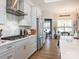 Modern kitchen with stainless steel appliances and white shaker cabinets at 14543 Crosswater Ln, Charlotte, NC 28278