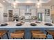 Modern kitchen island with a white quartz countertop and gray cabinets at 14543 Crosswater Ln, Charlotte, NC 28278
