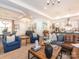 Open living space featuring a leather sofa, armchairs, and a large coffee table at 14543 Crosswater Ln, Charlotte, NC 28278