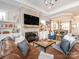 Open living room with a fireplace and ample natural light at 14543 Crosswater Ln, Charlotte, NC 28278