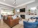 Spacious living room with a fireplace, built-ins, and large sectional sofa at 14543 Crosswater Ln, Charlotte, NC 28278